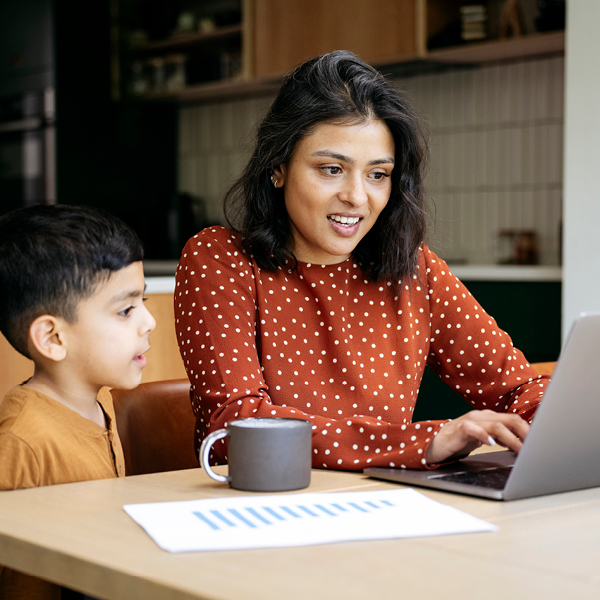 Mother and son at laptop