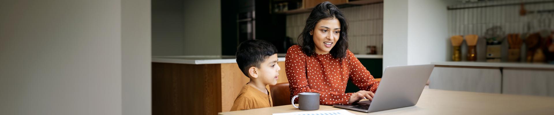 Woman and child looking at computer